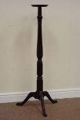 20th century mahogany torchere stand on tripod base, carved and fluted detail,