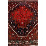 Persian Afshar red ground rug, central medallion with stylized bird decoration,