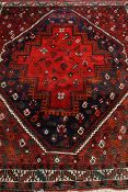 Persian Afshar red ground rug, central medallion with stylized bird decoration,