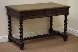 Victorian heavily carved oak barley twist writing table with leather inset top fitted with two