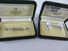 Mikimoto pearl golf club tie-pin stamped silver and a pair of similar cuff-links both boxed