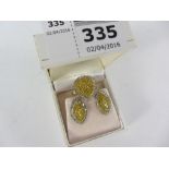 White and yellow diamond gold ring and pair of matching ear-rings hallmarked 9ct
