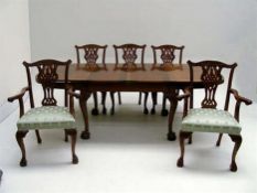 Early 20th century mahogany extending dining table with ball and claw feet W222cm extended;