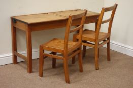 Late 20th century oak double hinged lid child's schools desk and two beech chairs W103cm, H59cm,