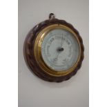 Early 20th century aneroid barometer mounted on carved oak by W. H.