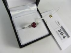 Oval ruby and round brilliant cut diamond white gold ring hallmarked 18ct ( ruby approx 1.