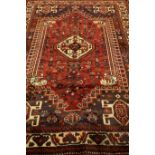 Persian Shiraz red ground rug,