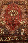 Persian Shiraz red ground rug,