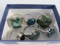 Six large stone set rings stamped 925