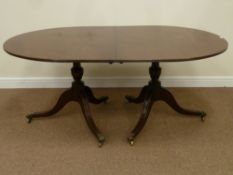 Regency oval mahogany twin pedestal dining table, triple splay legs with hairy brass castors, W112,