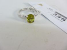 White gold ring set with a yellow stone hallmarked 9ct