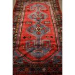 Persian Hamadan red and blue ground rug,