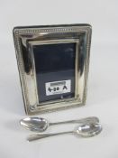 Hallmarked silver freestanding photo frame and two spoons