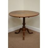 Early 19th century circular flamed mahogany tilt top table on turned pedestal base fitted with