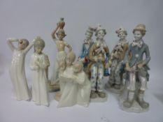 Four clown figures and other Spanish figures in one box
