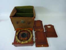 Early 20th century Thornton Pickard mahogany and brass plate camera with lens and three slides,