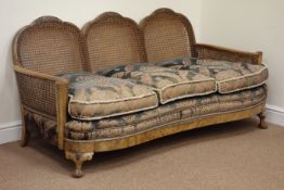 Early 20th century walnut framed bergere lounge suite, scroll arms with carved detail,