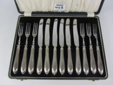 Cased set of knives and forks with hallmarked silver handles