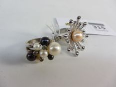 Two contemporary pearl set rings stamped 925