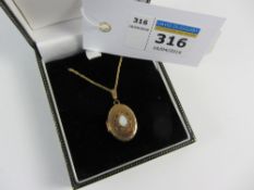 Early 20th century gold oval locket necklace set with an opal hallmarked 9ct