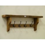 Waxed reclaimed pine wall hanging coat rack fitted with four hooks,
