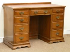 Edwardian walnut twin pedestal desk fitted with nine drawers, leather inset writing surface, W122cm,