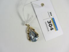 Gold pendant set with a diamond and pale blue stone