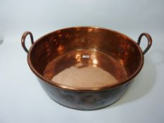 Large copper twin handled pan W48.