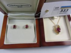Ruby and diamond pendant stamped 925 on chain and a similar pair of ear studs Condition