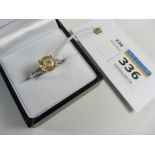 White 18ct gold ring set with a yellow sapphire and tapered diamonds hallmarked (sapphire approx 2