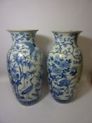 Large pair of Japanese Meiji period Arita vases, painted in underglaze blue with peacocks, cranes,