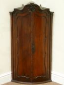 Mid 18th century Dutch mahogany shaped top corner cabinet,