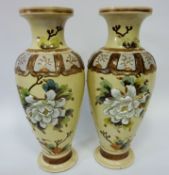 Pair of early 20th century Japanese vases with applied floral decoration,