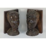 Pair of African head bookends carved from two solid piece of rosewood,