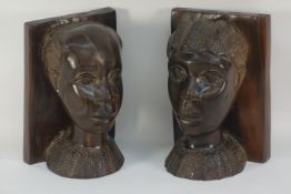 Pair of African head bookends carved from two solid piece of rosewood,