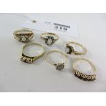 Three rings set with opals,