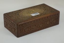 Late 20th century box wood and ebony chest set and draughts set housed in Eastern heavily carved