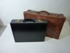 Leather suitcase with inner fittings and a briefcase with key and documents case