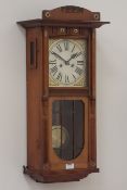 Edwardian walnut wall hanging clock, mounted brass decoration, turned columns and carved detail,