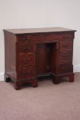 Georgian style mahogany kneehole desk fitted with seven drawers and centre cupboard, W96cm, H78cm,