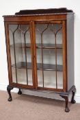 Early 20th century mahogany bow front display cabinet enclosed by two glazed doors,