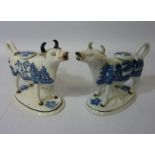 Pair late 19th/early 20th century blue and white willow pattern cow creamers Condition