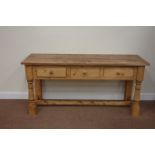 Acacia wood top dresser fitted with three drawers, raised on turned pine stretcher base, W161cm,