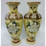 Pair of early 20th century Japanese vases with applied floral decoration,