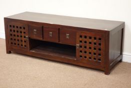 Hardwood Chinese style television stand fitted with cupboards either side,