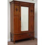 Edwardian walnut wardrobe enclosed by single bevelled mirror door, drawer to base, W128cm,