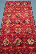 Persian Baluchi red ground rug,