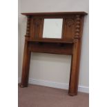 Early 20th century medium oak fire surround with centre bevelled mirror, W153cm, H166cm,