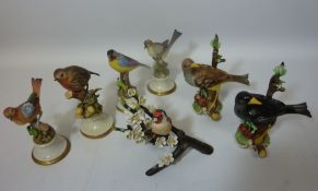 Six Capodimonte bird studies and a Franklin Porcelain sculpture 'European Goldfinch' (7)