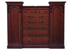 Victorian mahogany wardrobe, central chest fitted with two short and five long graduating drawers,
